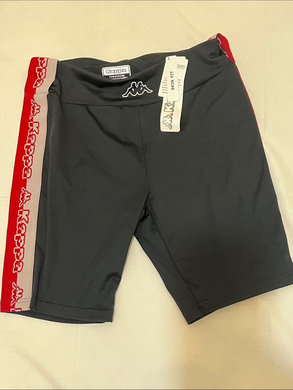 Kappa NWT Skin Fit Women’s Black Bike Shorts. With Red Logo Side Stripes Size M.